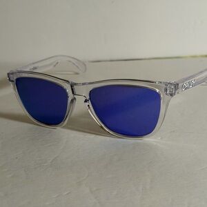 Oakley Transparent Frame Sunglasses with Deep Blue Lenses